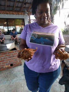 Shauna, our Pin Point tour guide holding blue crabs